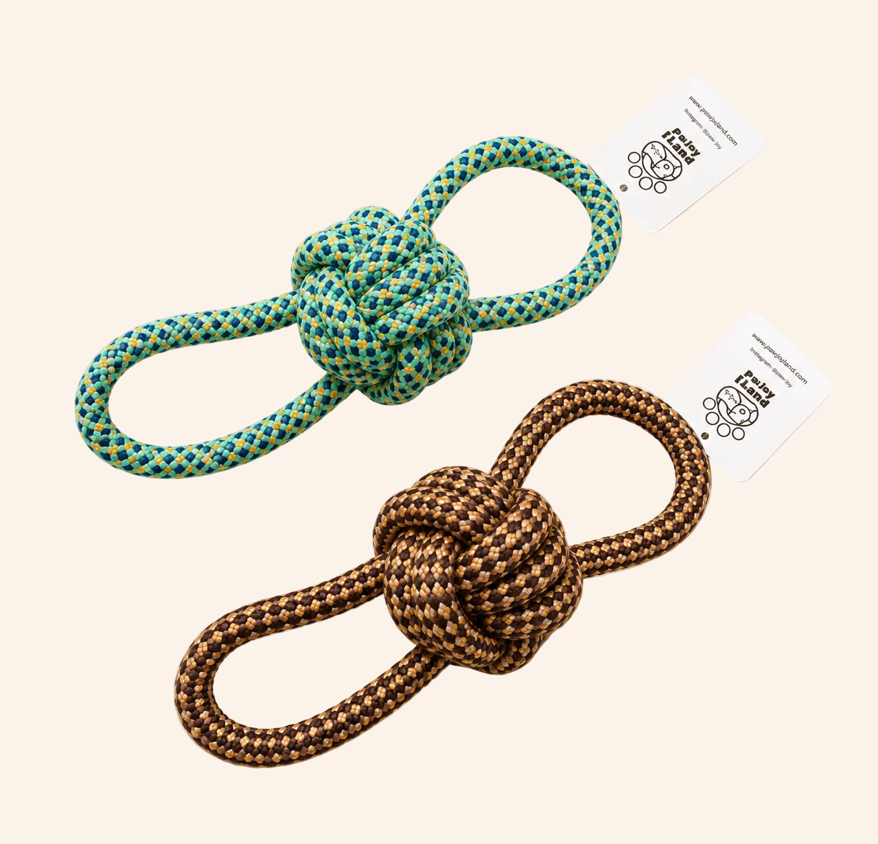 Two knotted rope toys with tags on a beige background
